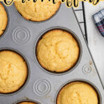 Corn muffins in a muffin tin cooling on a wire rack. Title text for Pinterest is at the top.