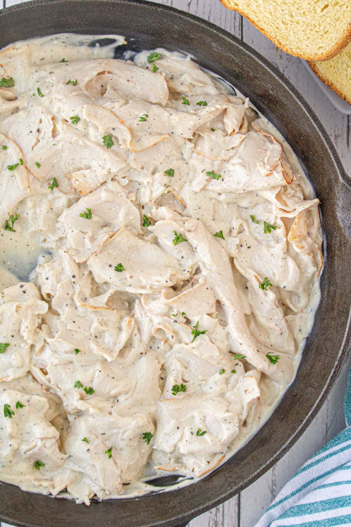 A skillet full of the creamed turkey in gravy.