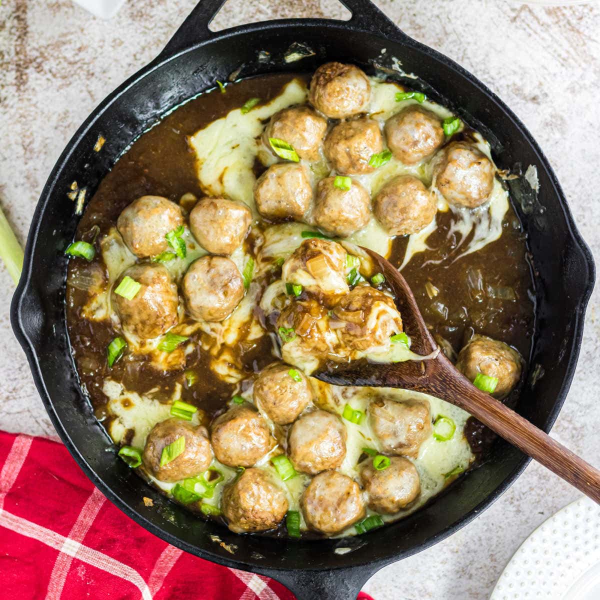 Overhead view of meatballs in the skillet.