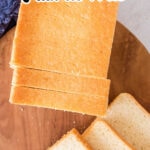Overhead view of the pullman loaf bread on a cutting board with text overlay for Pinterest.