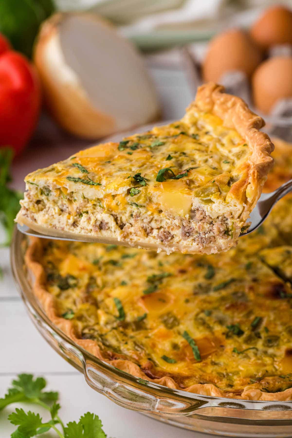 A slice of homemade quiche being served.