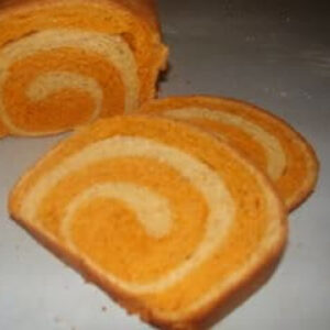 Close up of the swirl in the tomato swirl bread.