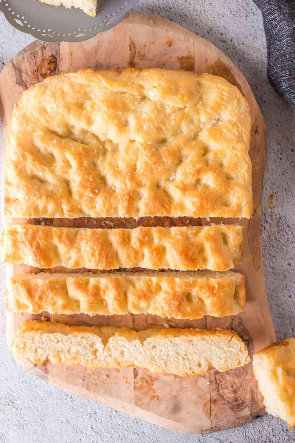 Overhead view of sliced up focaccia bread.