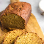 Sliced acorn squash bread on a wooden board with a title text overlay.