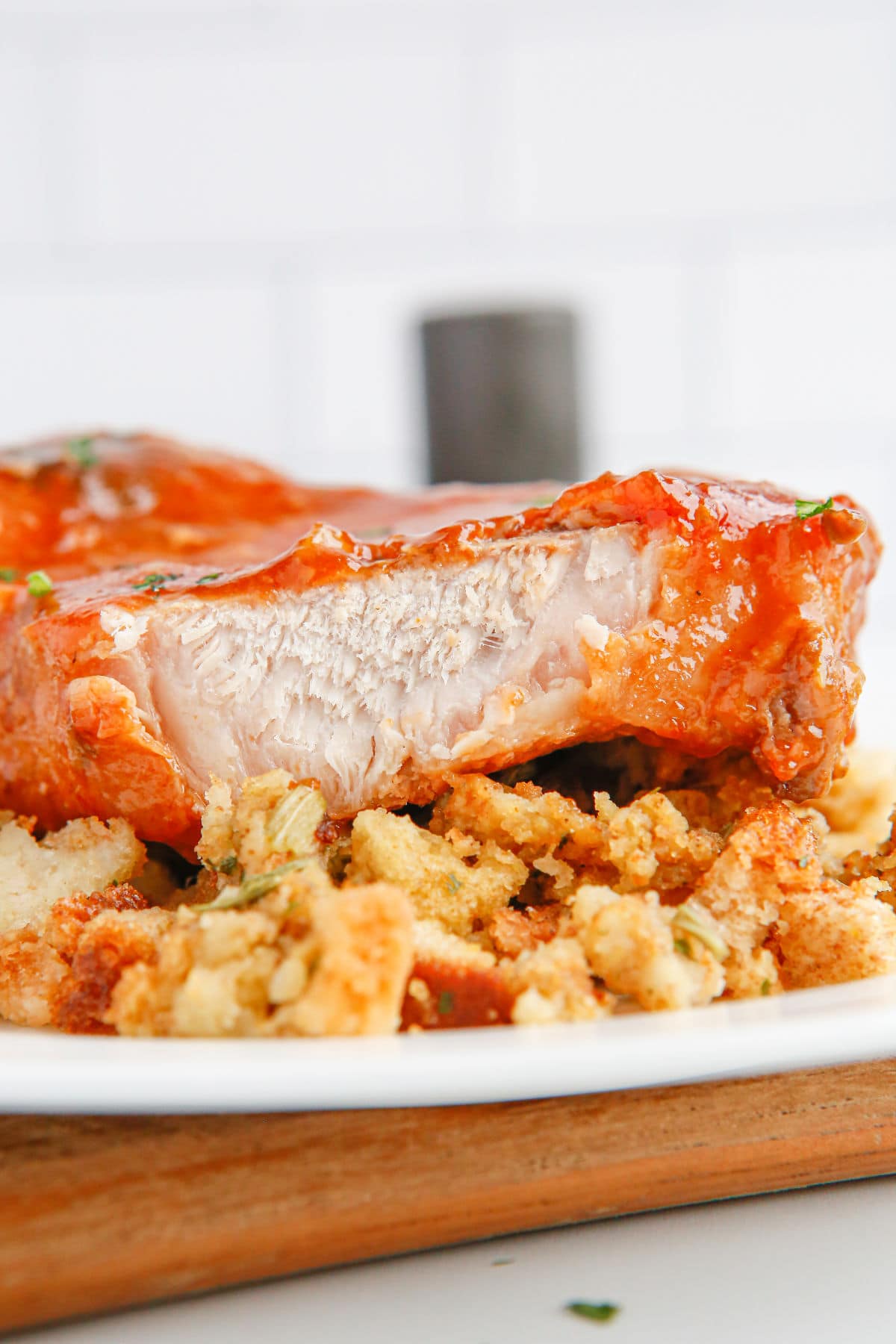 Honey garlic pork chop sliced open to show the moist, juicy interior.