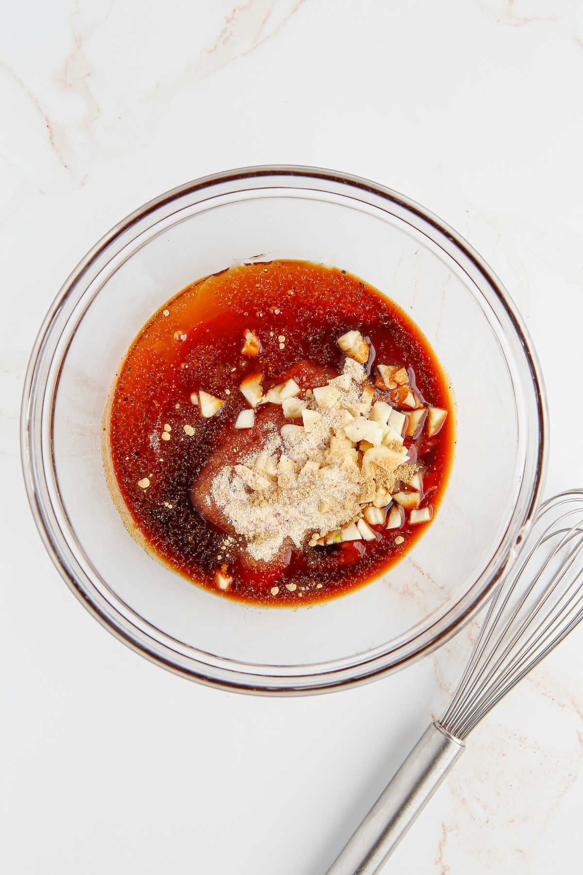Ingredieents for the sauce in a mixing bowl.