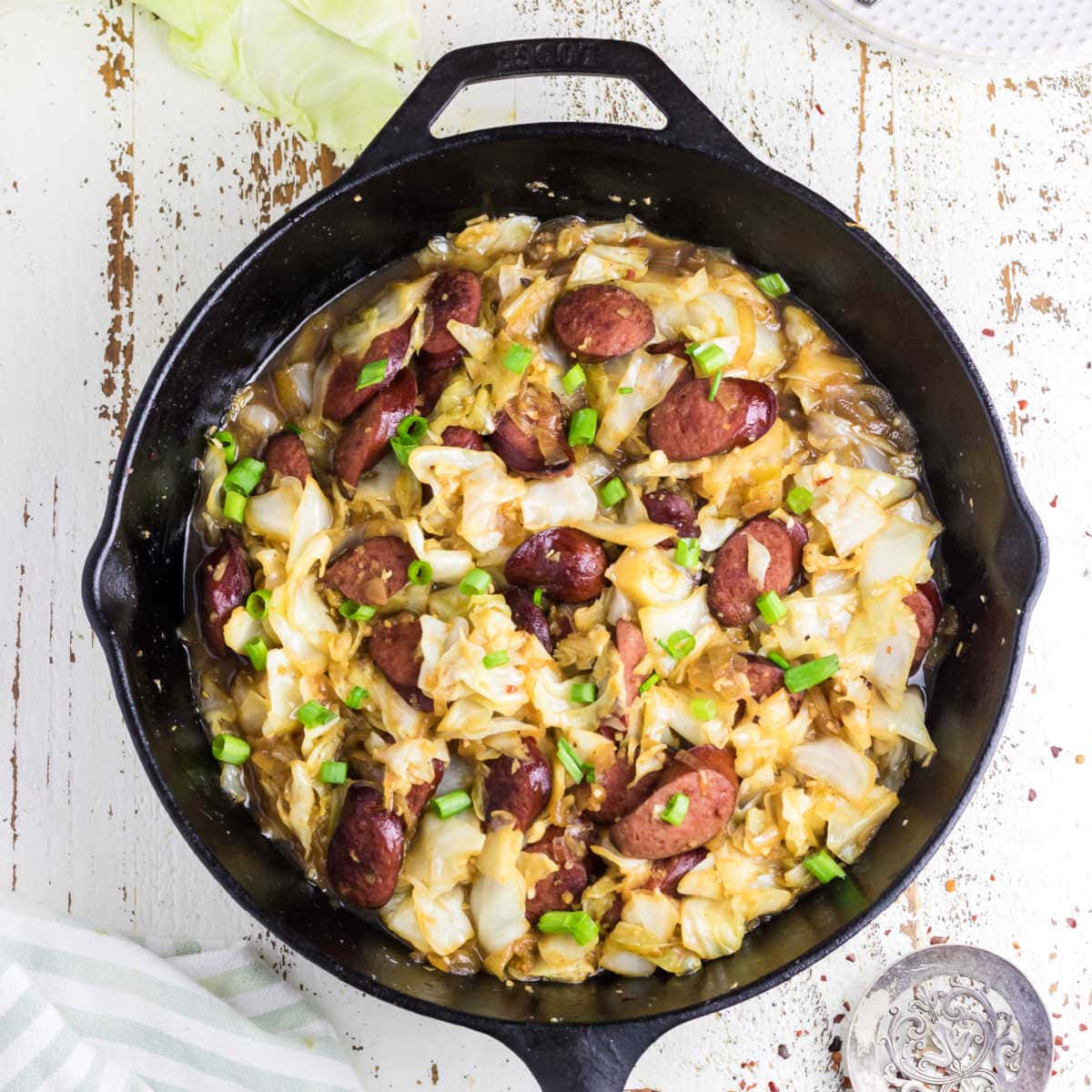 Overhead view of a cabbage and kielbasa skilelt dinner.