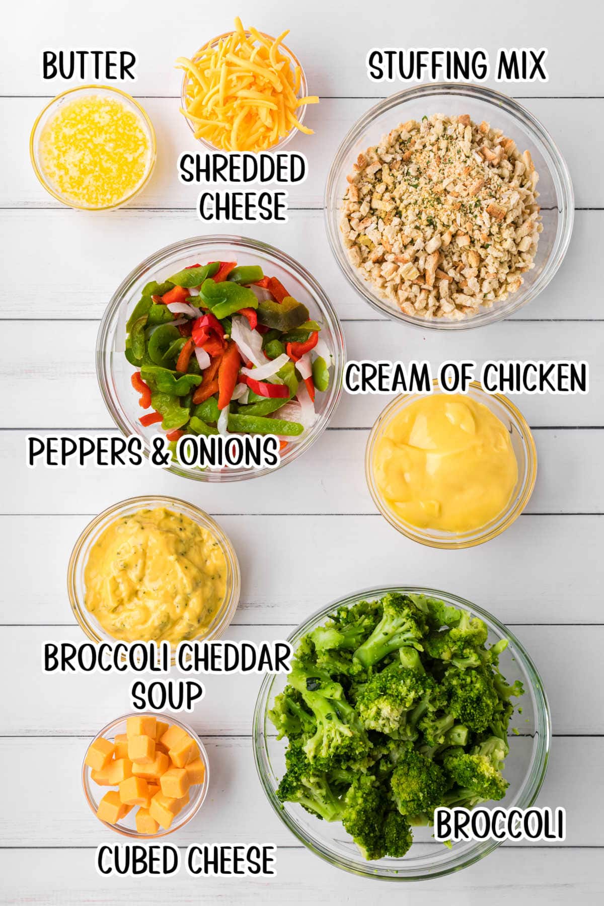 Ingredients in glass bowls: butter, cheese, stuffing, broccoli cheddar soup, fresh broccoli, peppers, onions, and soup.