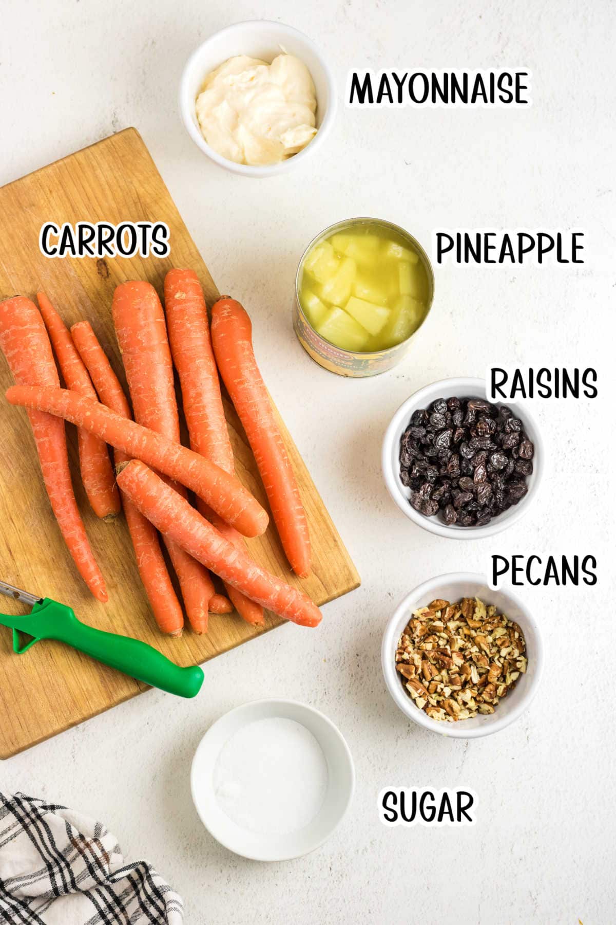 Labeled ingredients for carrot raising salad with pineapple.