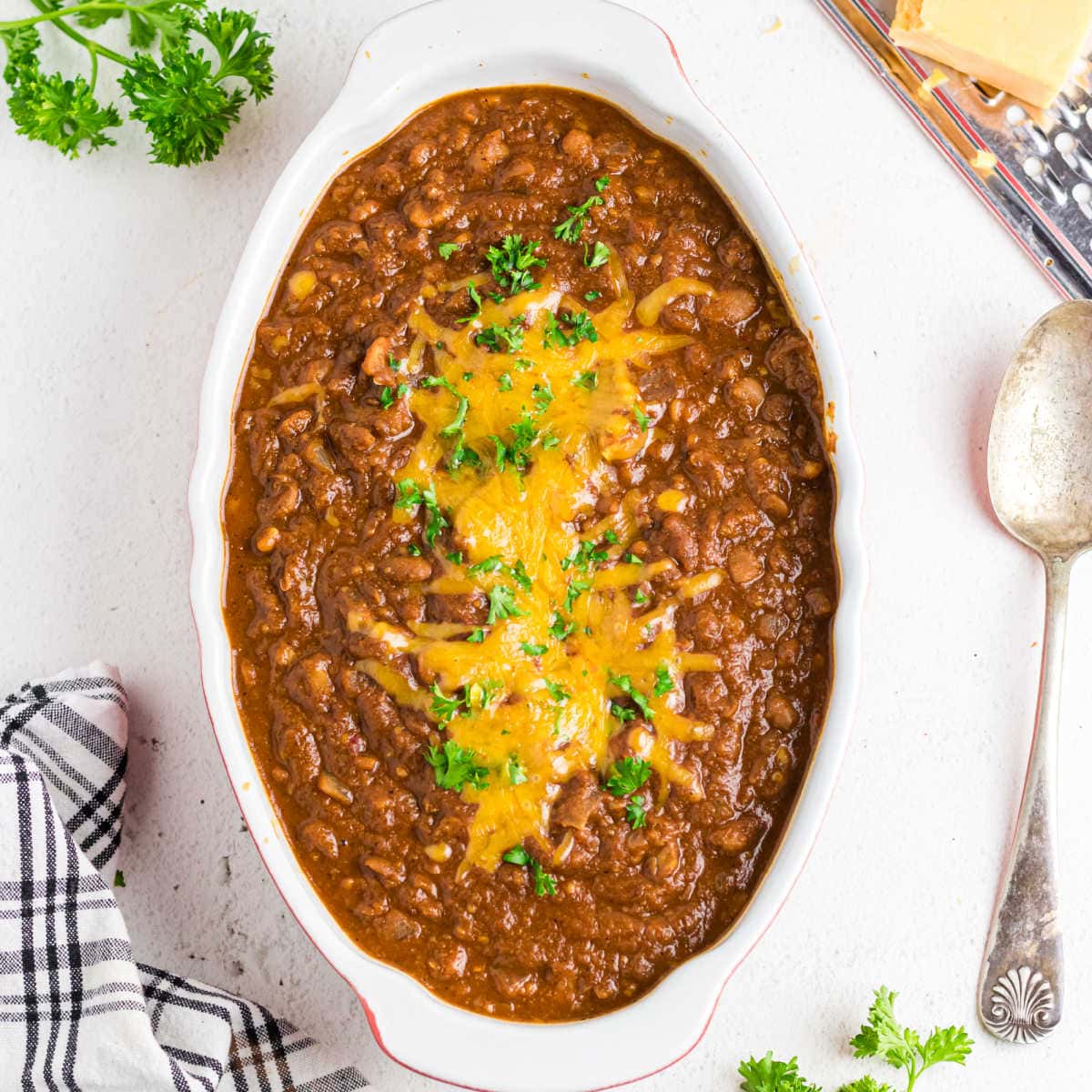 Overhead view of Ranch Style beans with cheese on top.