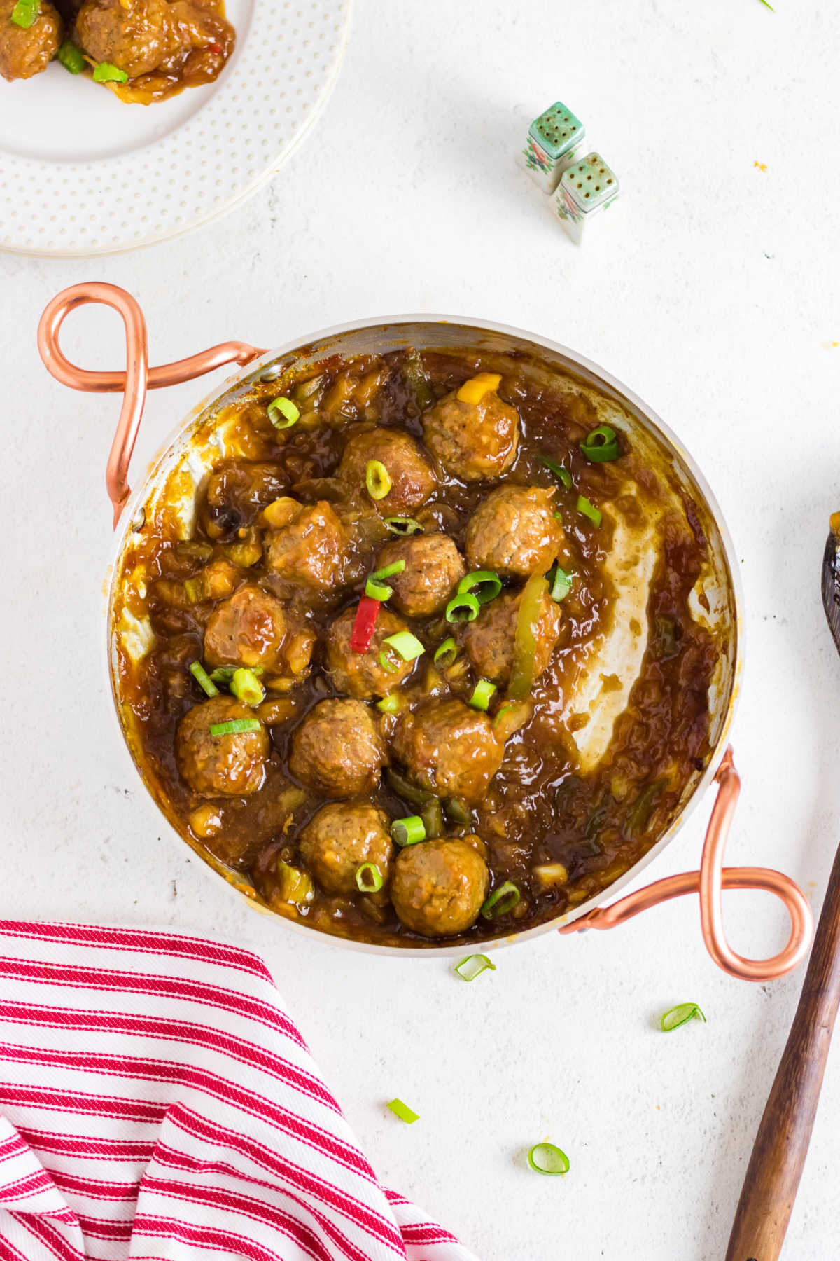 Overhead view of teriyaki pineapple meatballs in a pan.