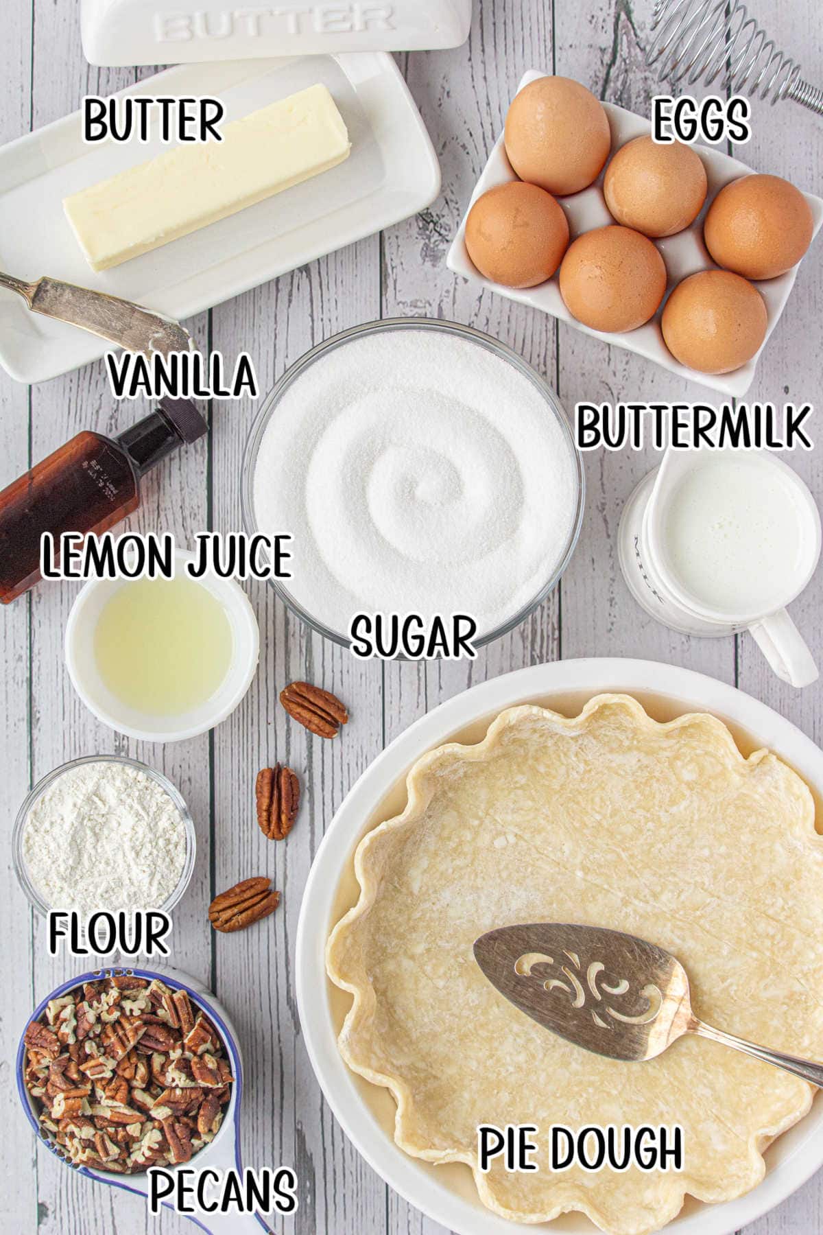 An overhead photo with text overlay showing the raw ingredients in small bowls or containers, including pie dough, pecans, buttermilk, eggs, butter, vanilla, flour, and lemon juice.
