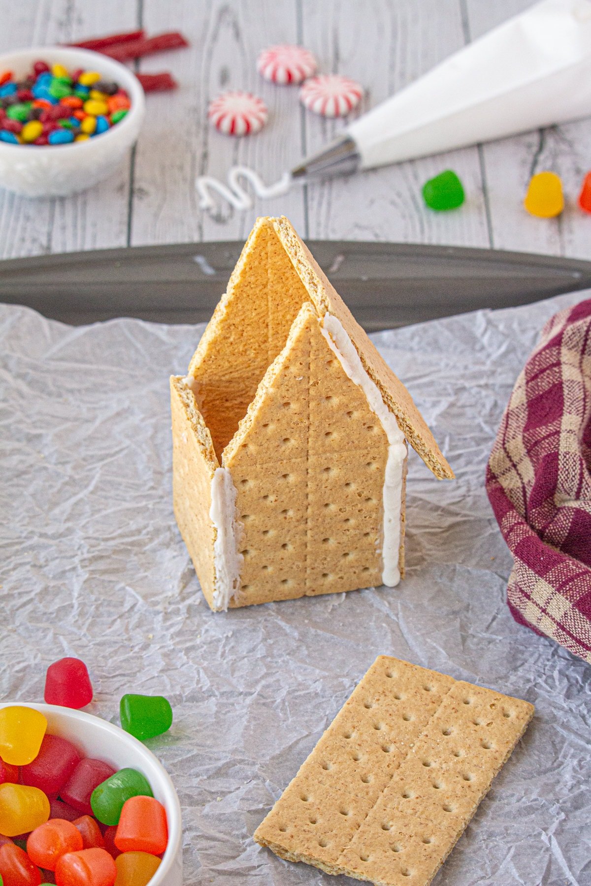Press it on the angled side of the tall graham cracker. Hold for a few seconds.