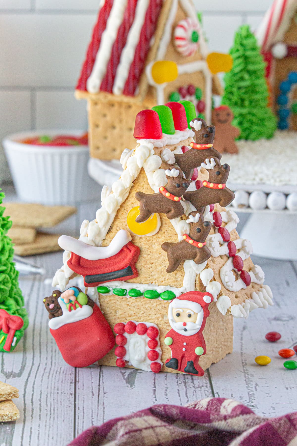 A finished gingerbread house showing a Santa