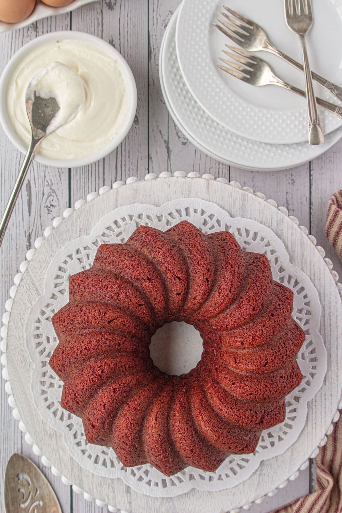 Overhead view of baked red velvet bundt cake without frosting.