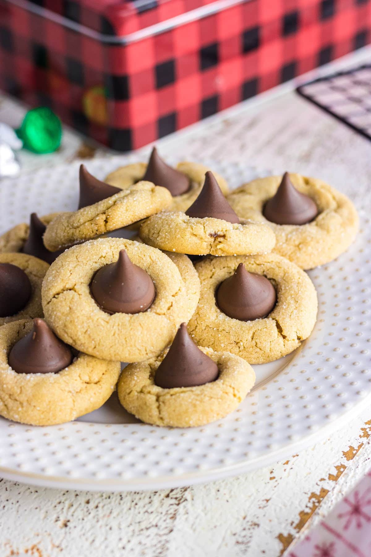 A plate of Hershey's peanut butter blossoms cookies on a table.