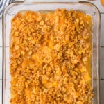 Overhead view of a classic pineapple casserole with text overlay for Pinterest.