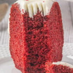 Slice of red velvet bundt cake on a plate wtih a title text overlay for Pinterest.
