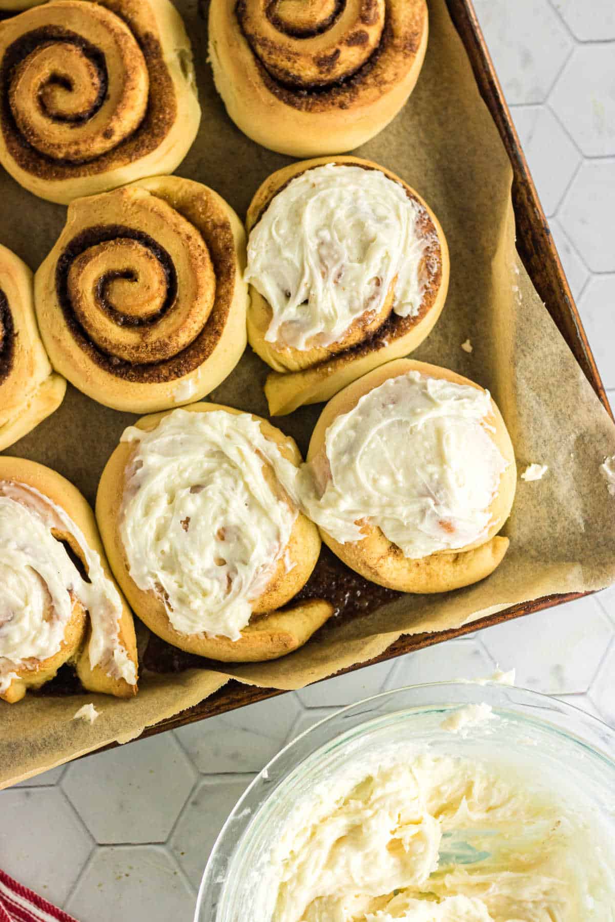 Overhead view of cinnamon rolls in a tray.
