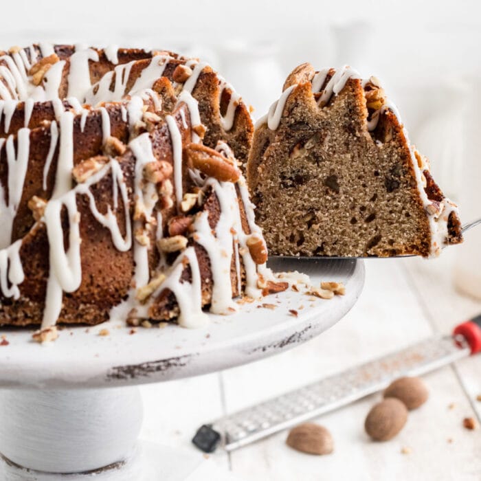 Southern bourbon pecan cake on a white cake plate.