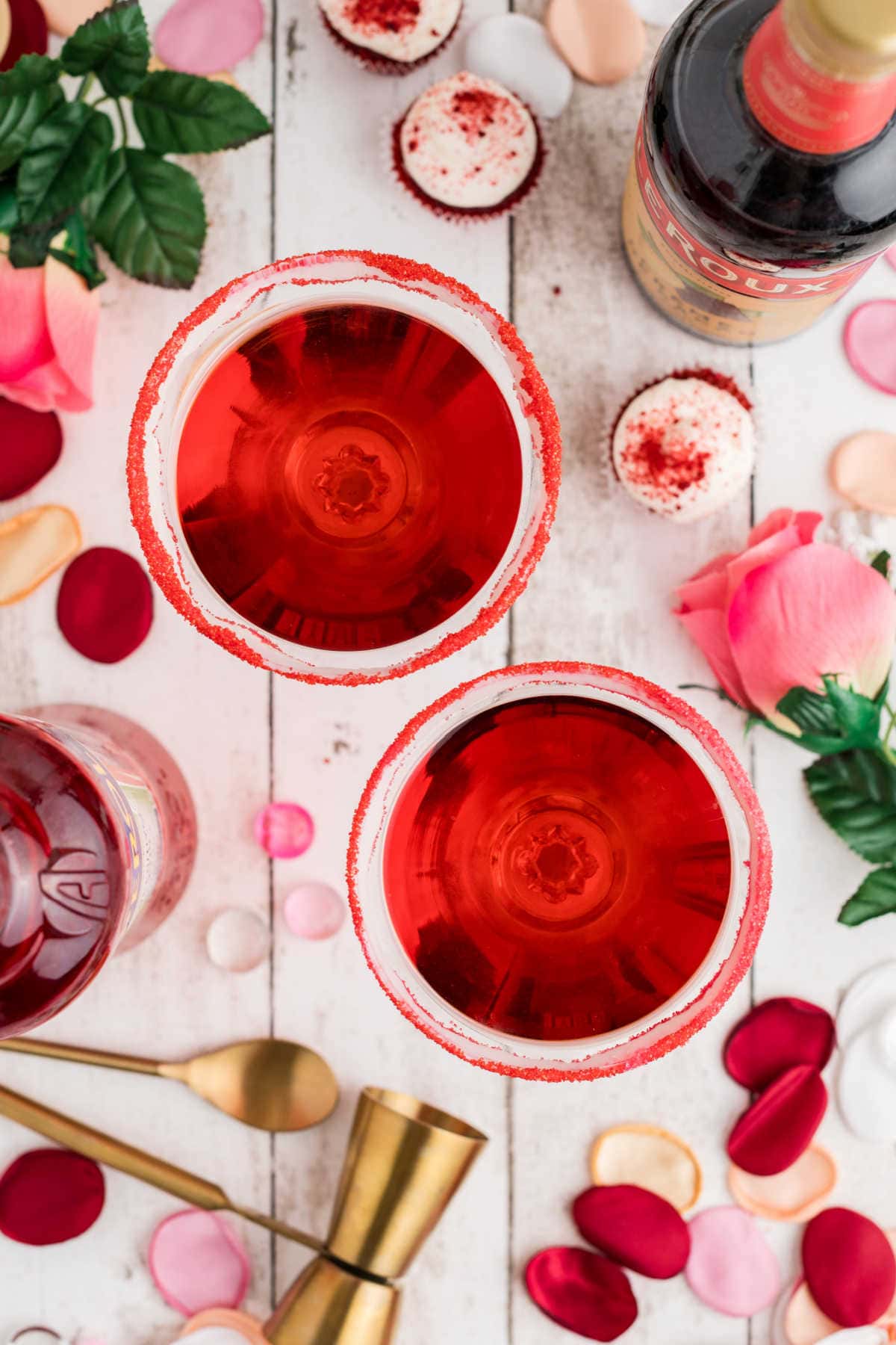 Red velvet martinis in glasses with red sugar rims.