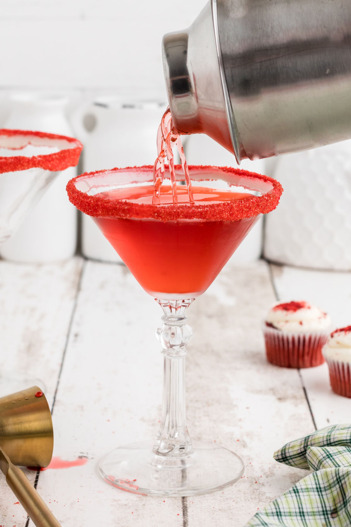 Red velvet martini in a martini glass with a red sugar rim.