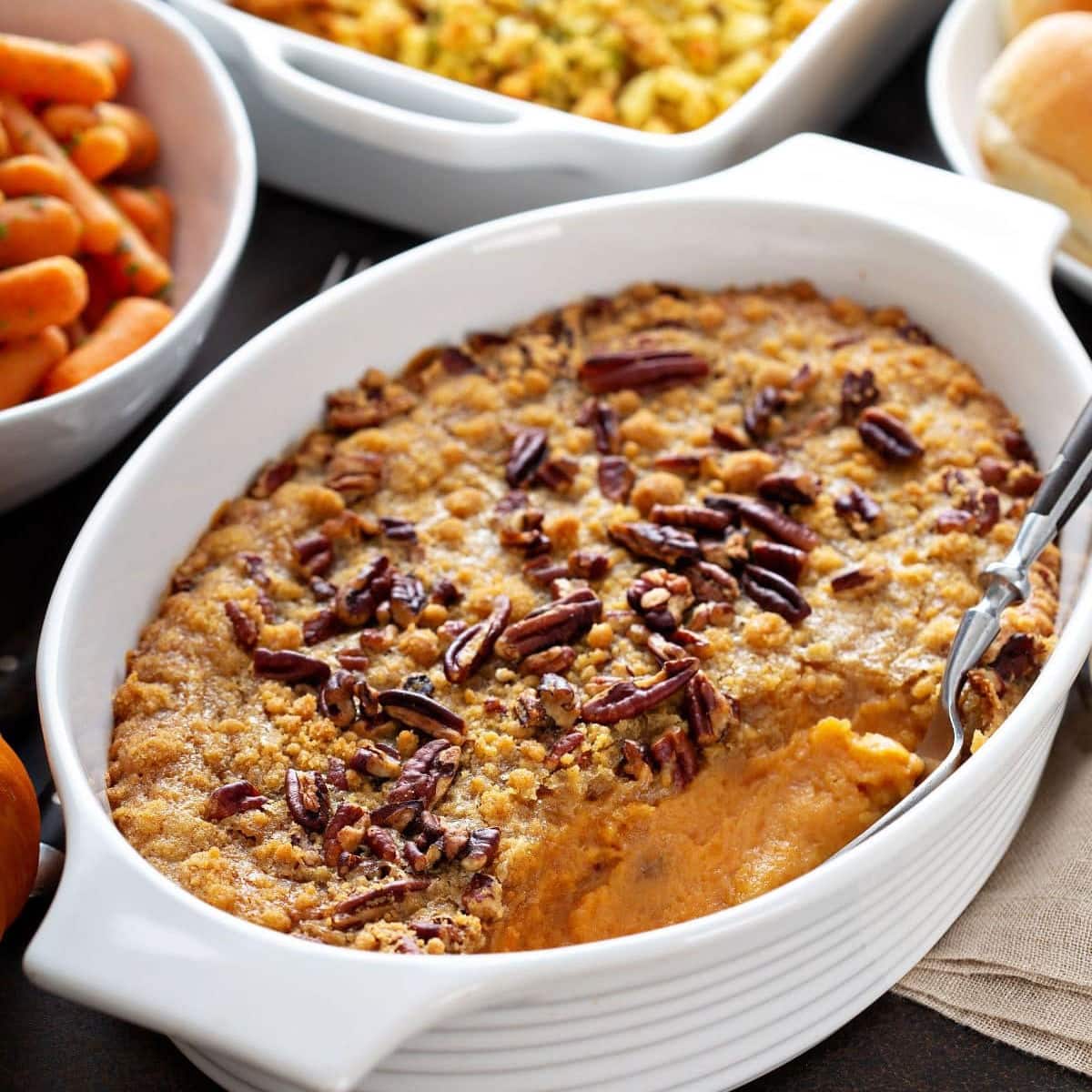 Closeup of several casseroles on a table.