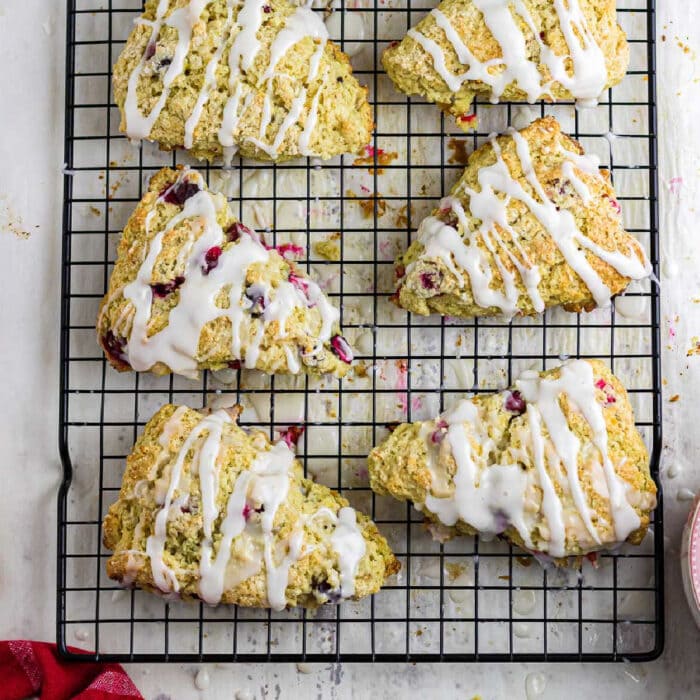 Cranberry orange scones on a cooling rack.