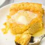 Spoon bread on a plate with butter melting on top and a title text overlay for Pinterest.