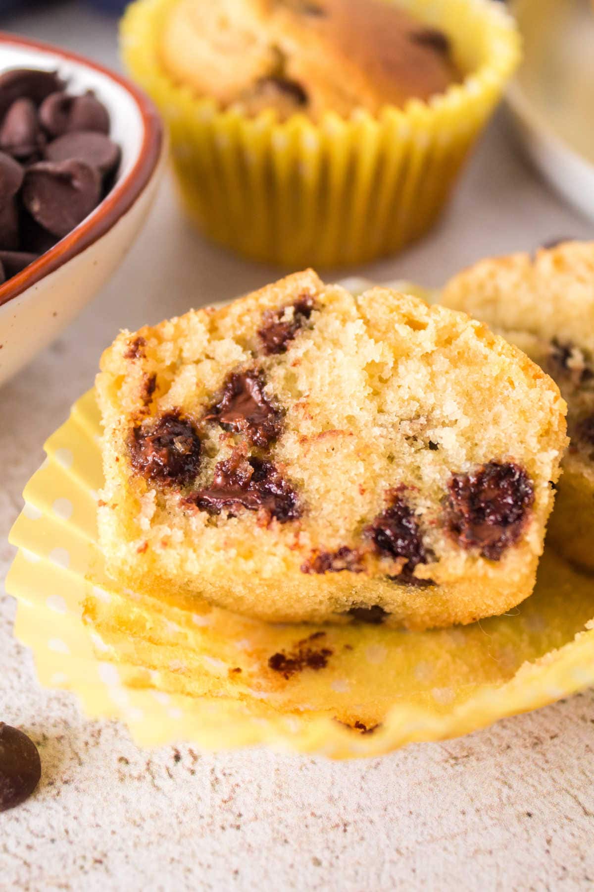 Air fryer chocolate chip muffin cut open to show the soft insides.