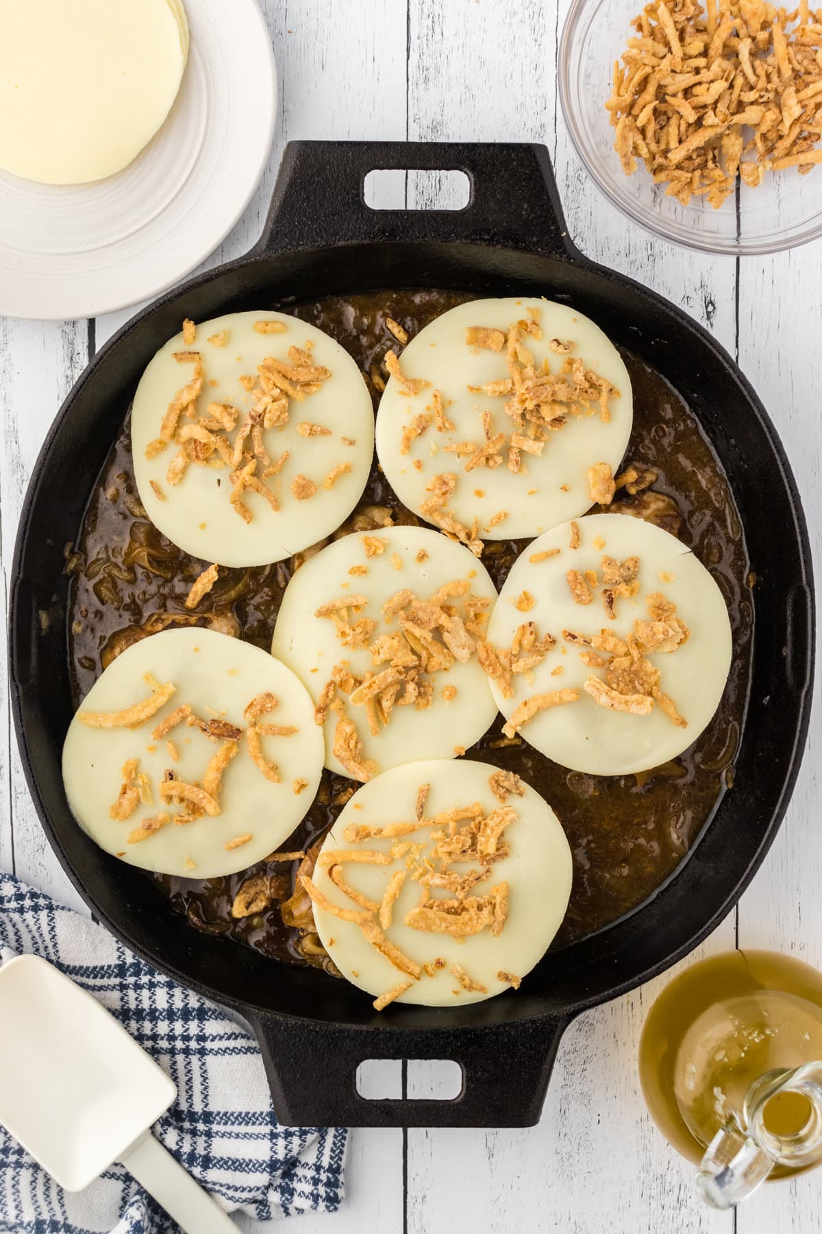 The cheese and crispy French onion toppings are added to the chops.