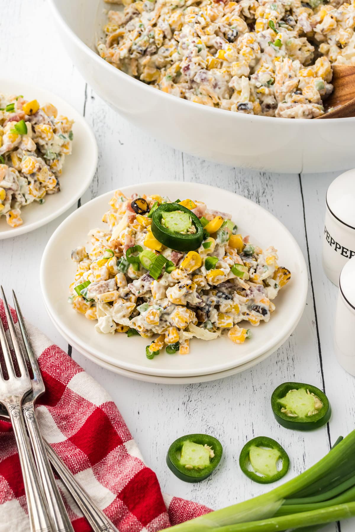 Creamy jalapeno corn popper salad on a small plate.