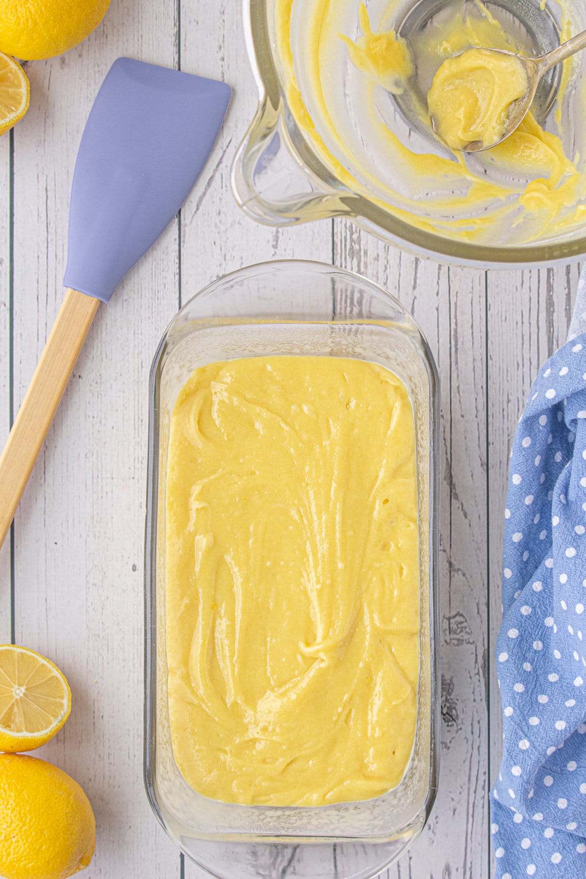 Batter spread in a glass loaf pan.