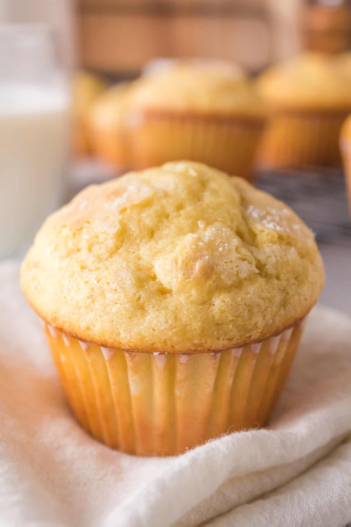 Closup of a vanilla muffin on a napkin.