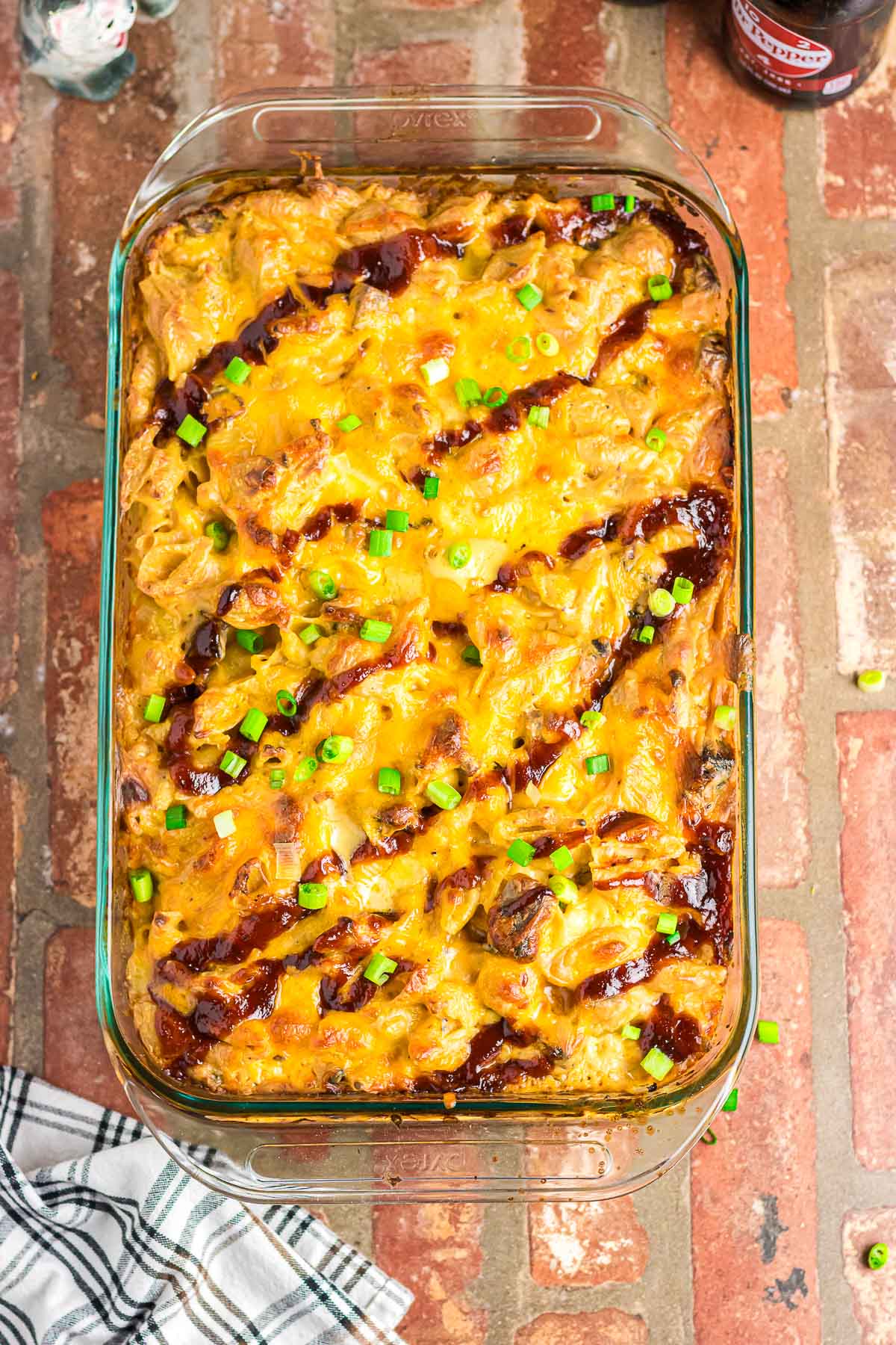 BBQ macaroni and cheese in a glass casserole dish.
