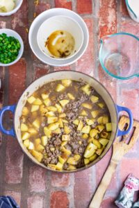 Beef and potatoes in a pot.