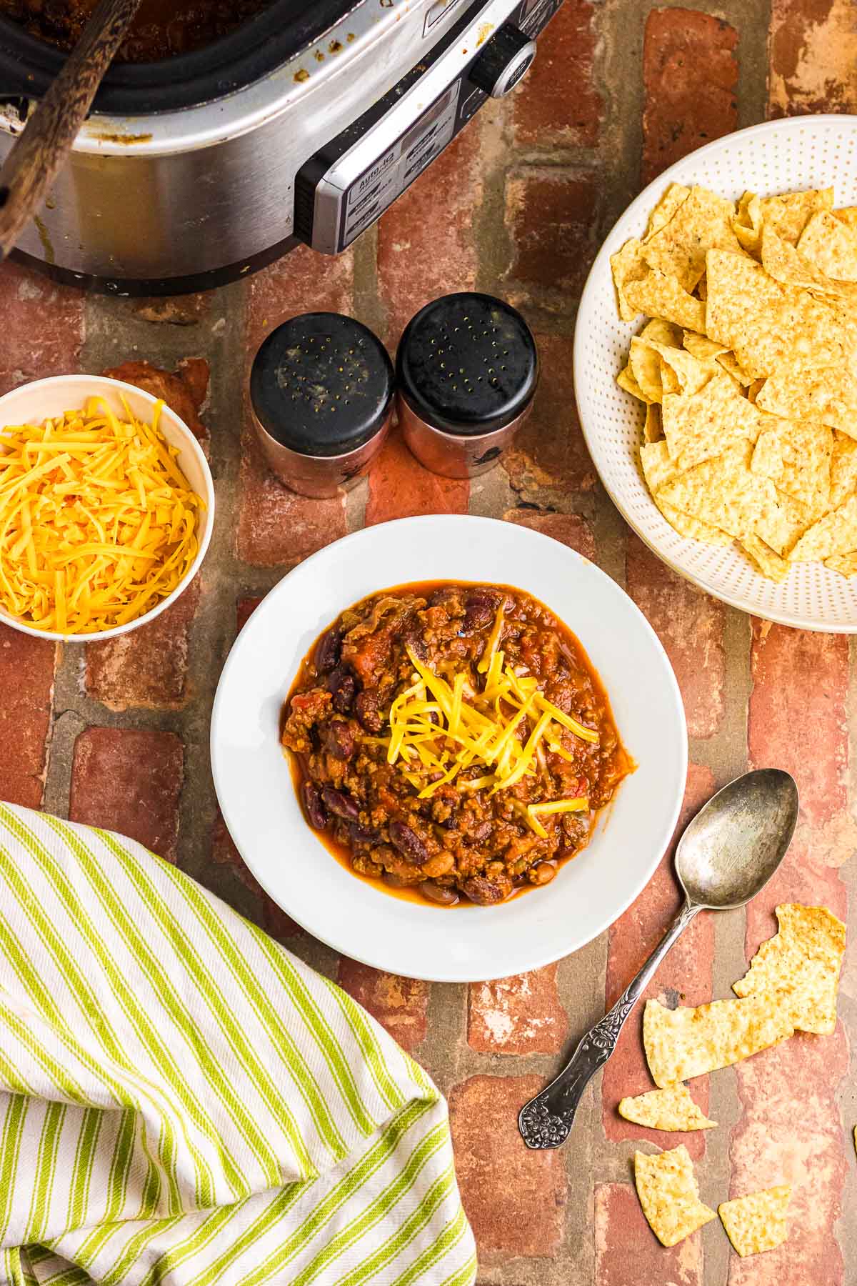 A bowl of Wendy's chili topped with shredded cheese.