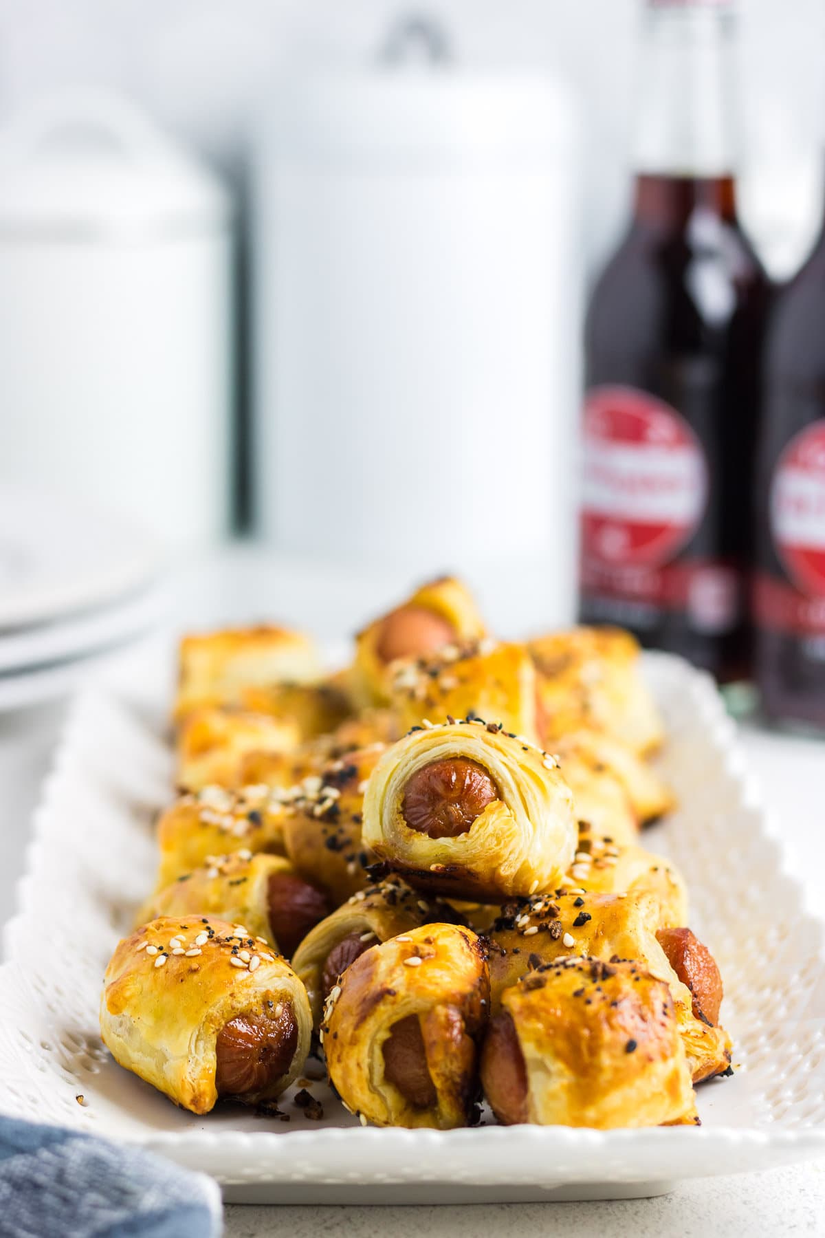 PIgs in a blanket on a serving tray.