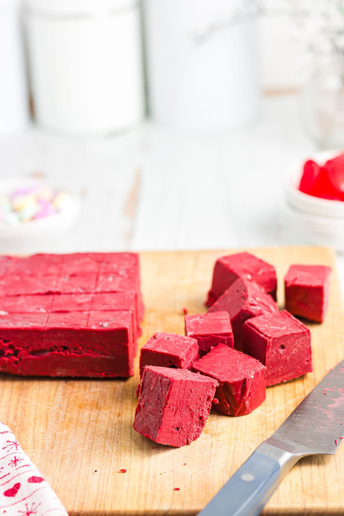 Red velvet fudge on a cutting board.