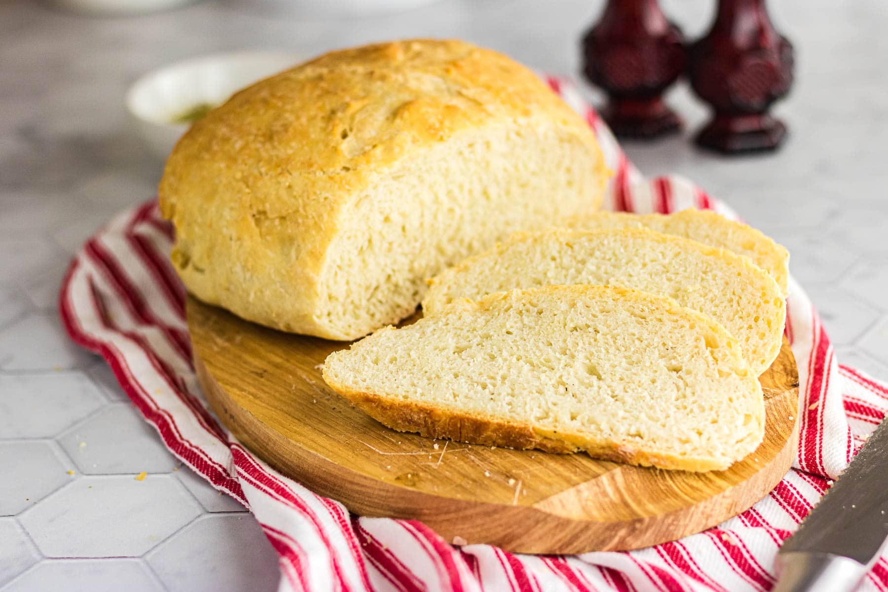 Sliced Italian bread with a thick golden crust.