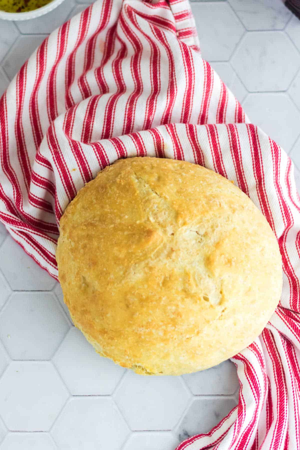 A whole loaf of rustic Italian bread.