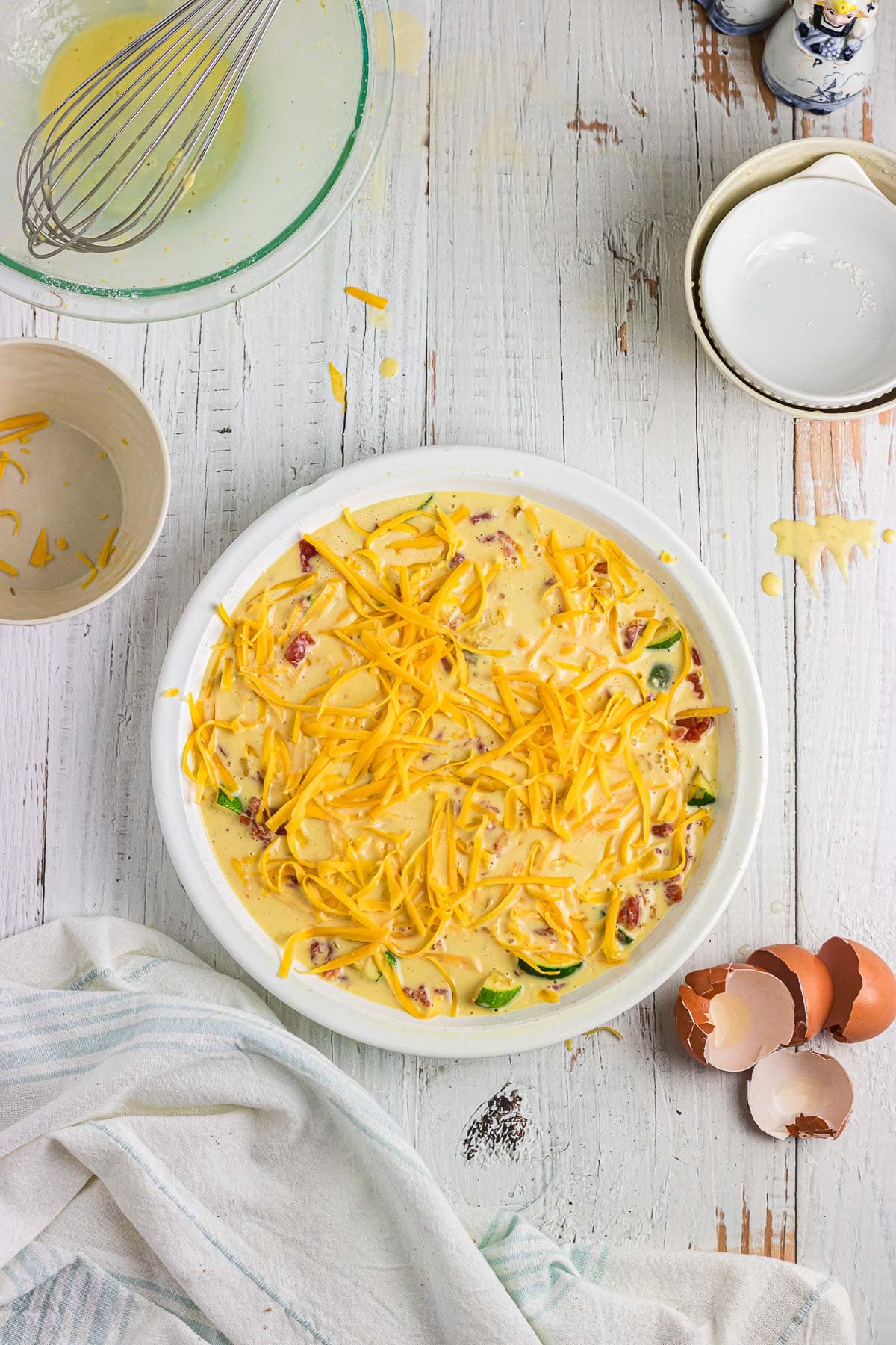 Egg mixture poured over the vegetables and cheese.