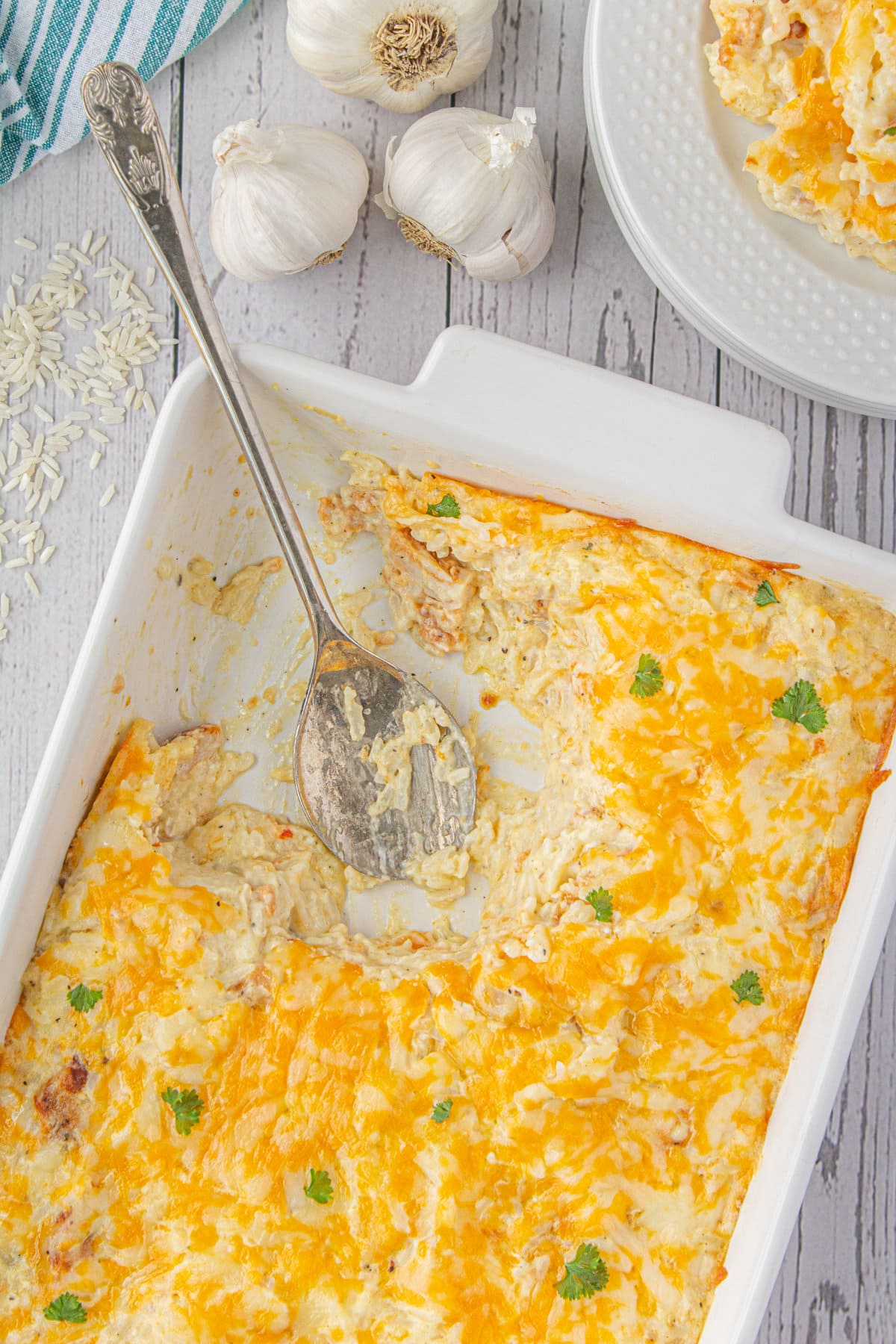 A scoop of angel chicken and rice casserole removed from the casserole dish.