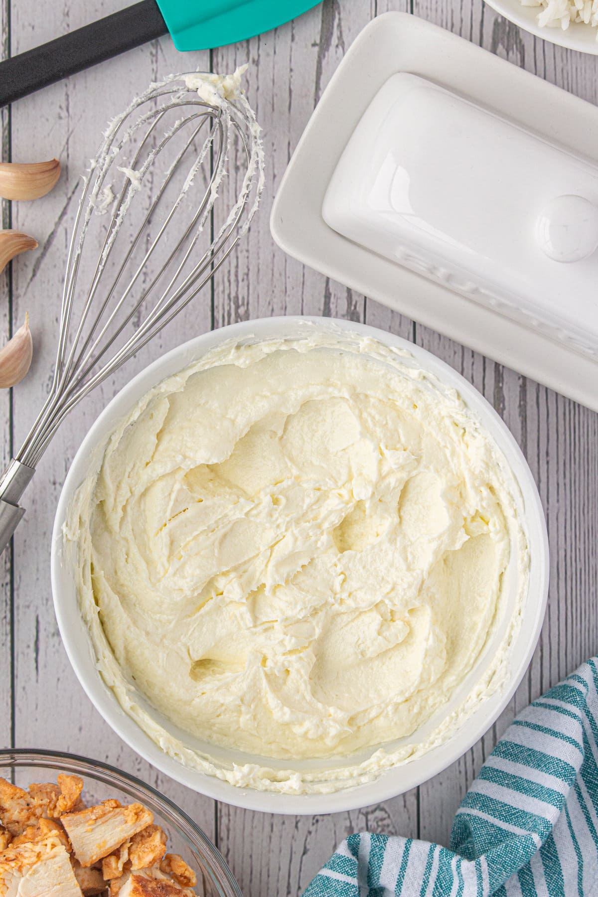 Softened butter and cream cheese in a bowl.