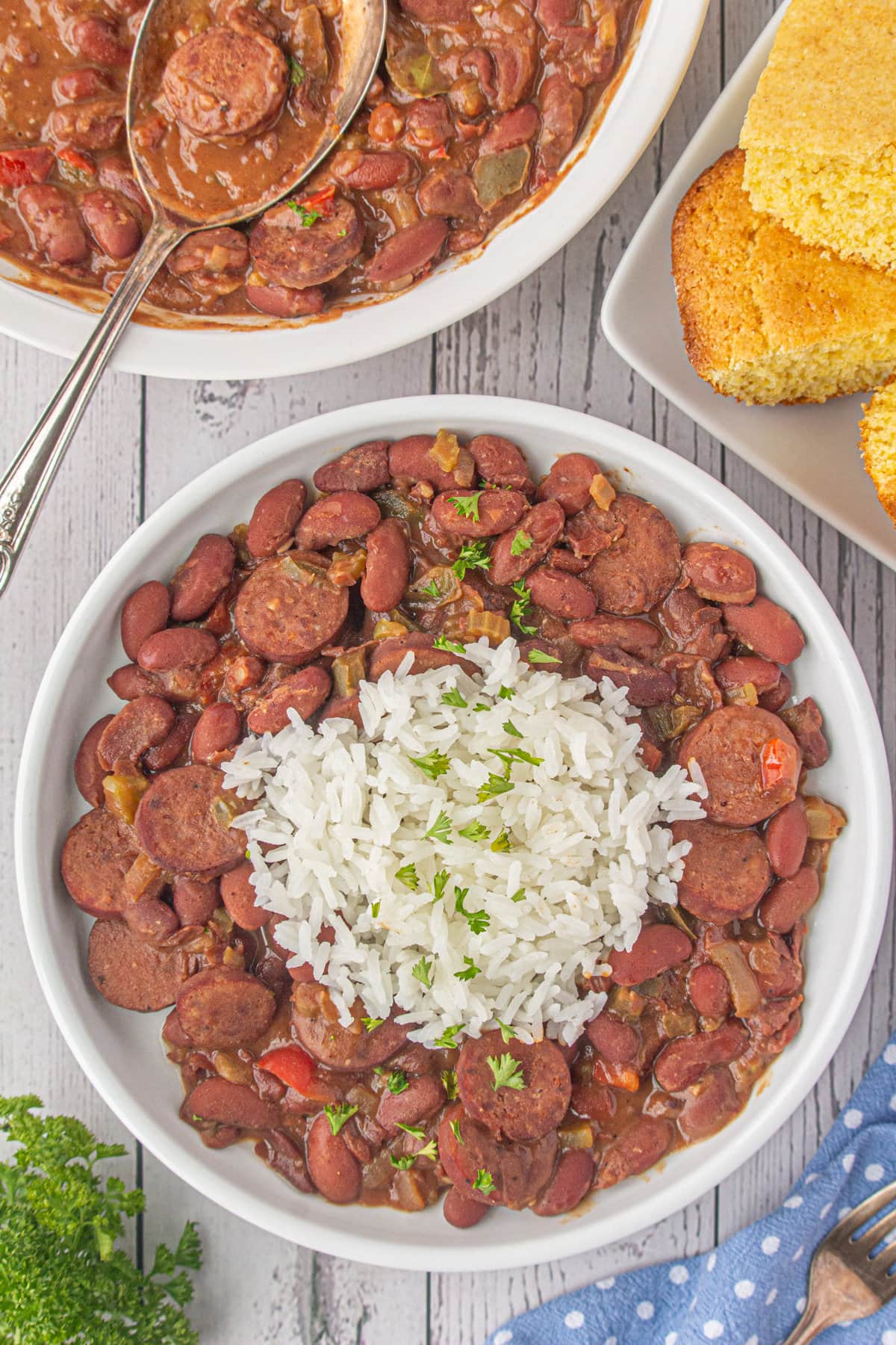 A big serving bowl of red beans and sausage with white rice.
