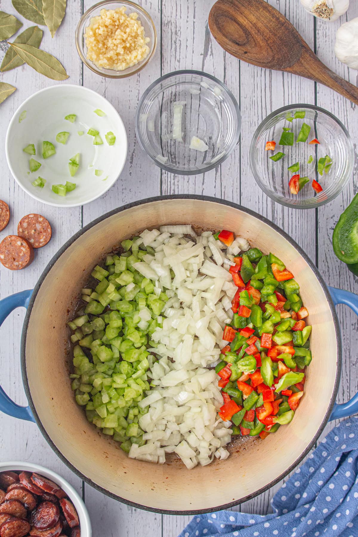 Diced peppers, onion, and celery in a Dutch oven.