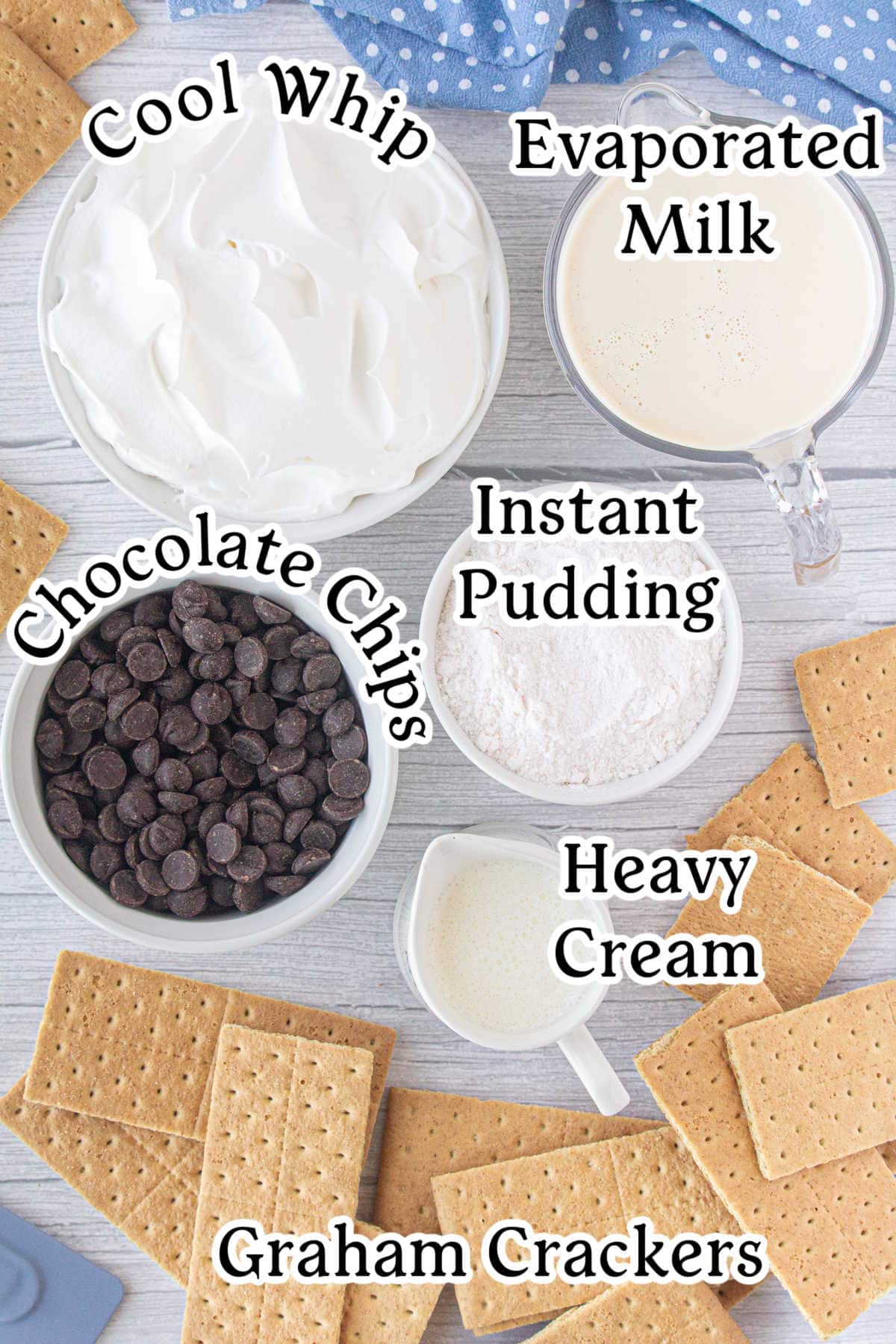 Labeled ingredients for the eclair cake recipe include graham crackers, pudding mix, Cool Whip, heavy cream, and chocolate chips.