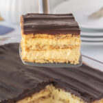 Close up of a slice of eclair cake being served.
