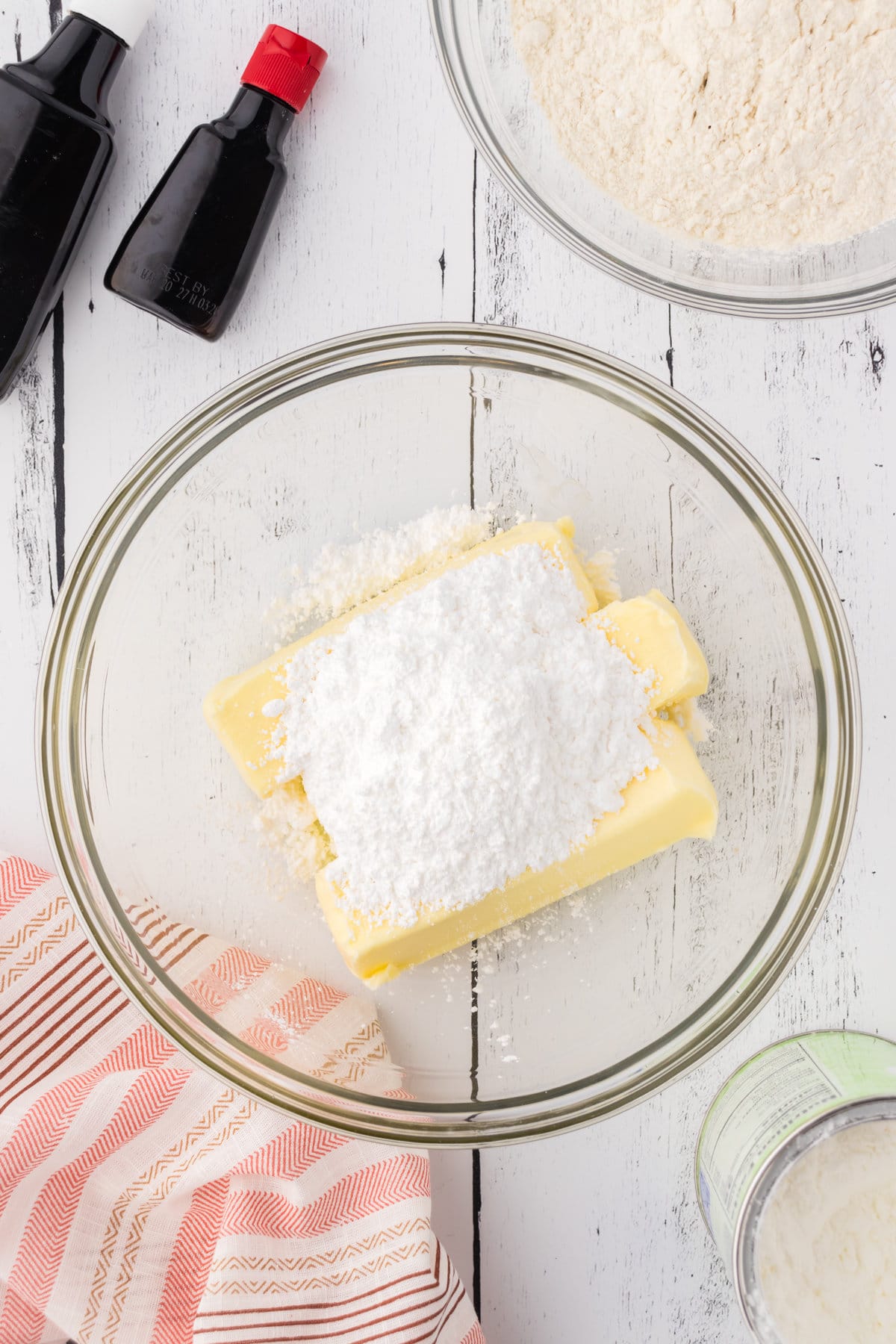 Butter and powdered sugar in a mixing bowl.