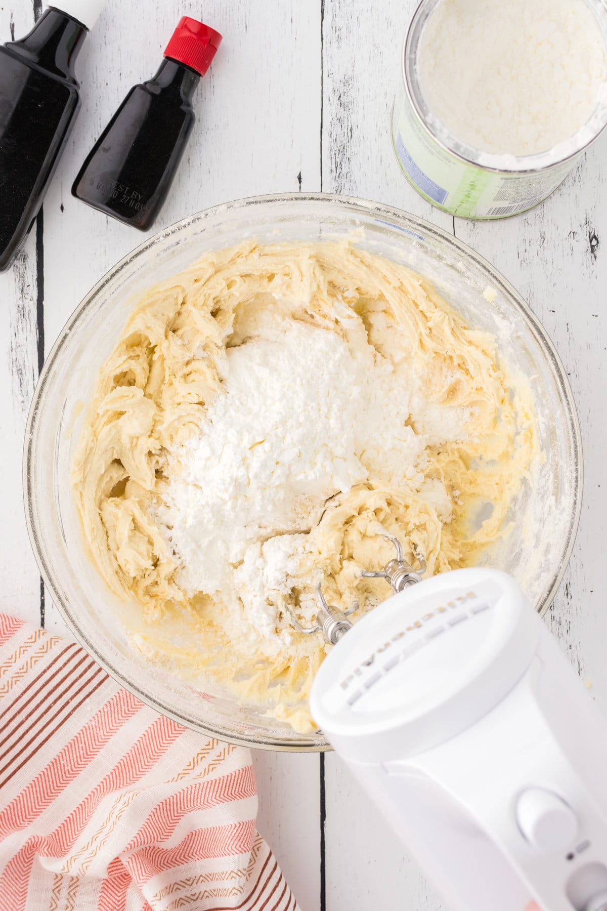 Cornstarch added to the butter and powdered sugar mixture to create dough.